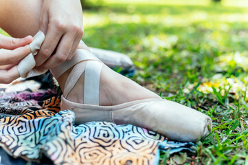 Close-up of the ballerina's feet in the park © Peruphotoart