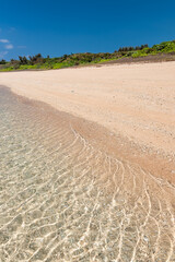 Beautiful crystal clear sea, glistening sea, coral sand at a tropial beach. Okinawa.