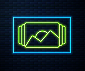 Glowing neon line Photo frame icon isolated on brick wall background. Vintage empty photos frame. Vector