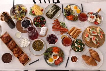 Many different dishes served on buffet table for brunch, flat lay