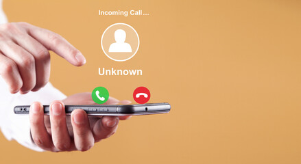 Man showing mobile phone with incoming call from unknown caller.