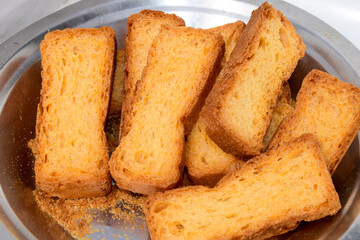 Crunchy Rusk or Toast for healthy life, Traditional biscuit , toast bread, crunchy toast, crispy milk rusk, toast plate on the table