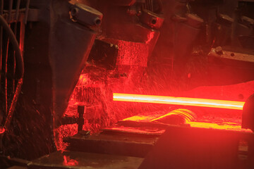 Hot steel billets in continuous casting machine.