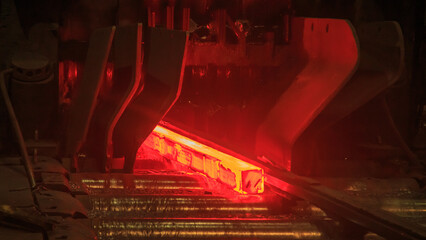 Hot steel billets in continuous casting machine.