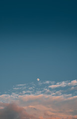 Picturesque photo of subtle moon in the evening sky