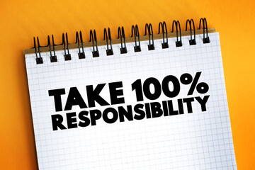 Take 100 Percent Responsibility text on notepad, concept background