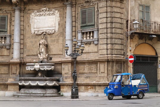 Palermo, Sicily (Italy): Quattro Canti and Piaggio Ape Car at Vigliena square, the center of the historic quarters of the city with the fountains Spring, Summer, Autumn and Winter