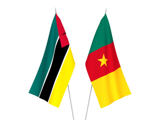 National fabric flags of Republic of Mozambique and Cameroon isolated on white background. 3d rendering illustration.