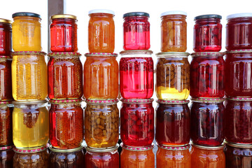 Stack of Colorful Armenian Pickles and Honey Jars for Sale on the Local Market
