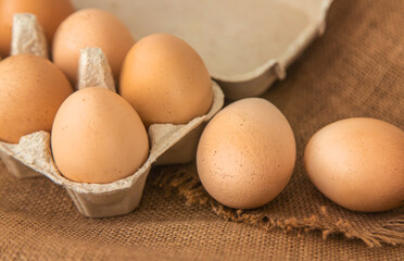 Chicken eggs close-up in a tray. Selective focus.
