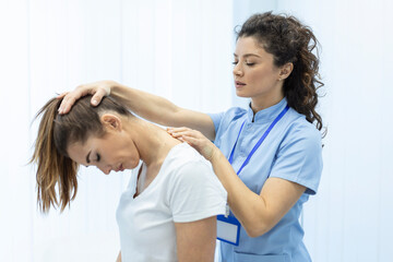 Physiotherapist doing healing treatment on womans neck,Chiropractic adjustment, pain relief...