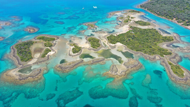 Aerial drone photo of paradise volcanic island complex resembling a blue lagoon archipelago in exotic destination bay with deep turquoise sea and crystal clear water beach