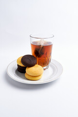 Hot tea and delicious brownies ready to eat on a white background