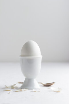 White egg on white eggstand holder