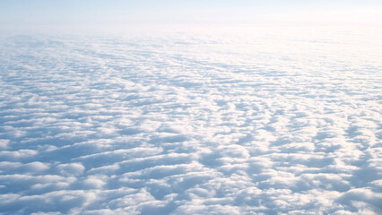 Beautiful cloudy blue sky from airplane window, view from above.Beautiful light natural background,copyspace for text