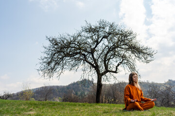 Young woman do yoga on the mountain. Meditation