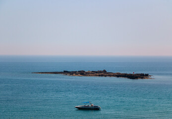 Fototapeta na wymiar Small stone island off the coast of Turkey in the Mediterranean Sea