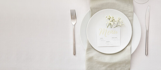 Beautiful table setting with floral decor on light background with space for text