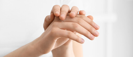Hands of beautiful young woman at home, closeup