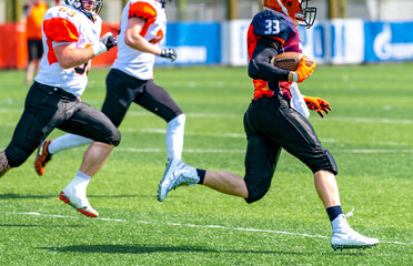 American football game.Receiver runs for the winning touchdown.College rugby training.