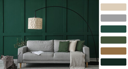 Interior of living room with sofa near green wall. Different color patterns