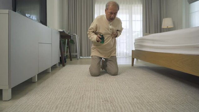 Old elderly sick senior Asian man fallen on floor and trying to get medicine from accident in bedroom in home or house. People. Health problem.
