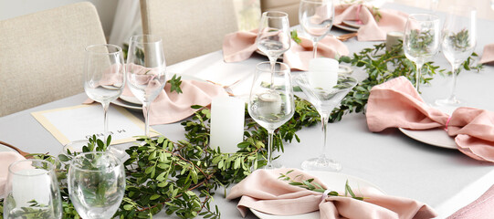 Beautiful wedding table setting with floral decor and candles