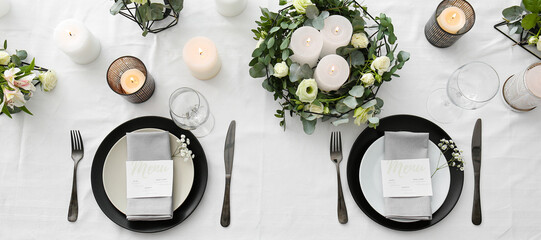 Beautiful wedding table setting with floral decor and candles - Powered by Adobe