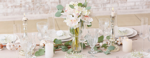 Beautiful wedding table setting with floral decor and candles