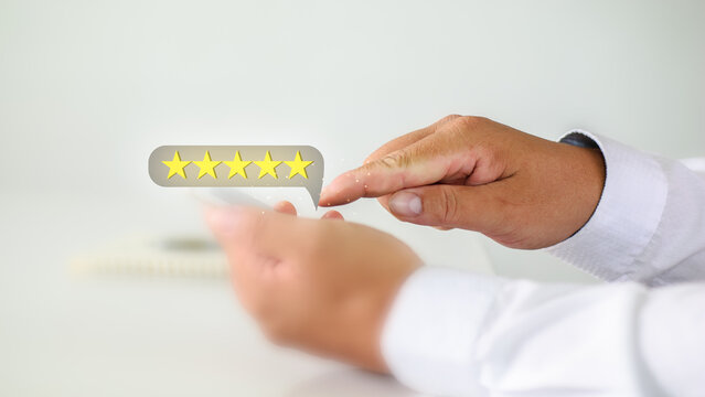Users rate the service experience on the online application,5-star rating image . Customer opinion poll concept. Customers can assess the quality of service leading to a business reputation rating.