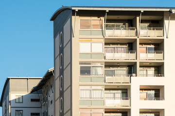apartment building view of a section of flats with balconies of modern and contemporary design closeup 