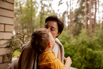 Happy grandmother and grandson enjoy time together. Positive middle age woman spending time with...