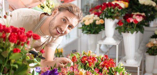 Florist making beautiful bouquet in shop