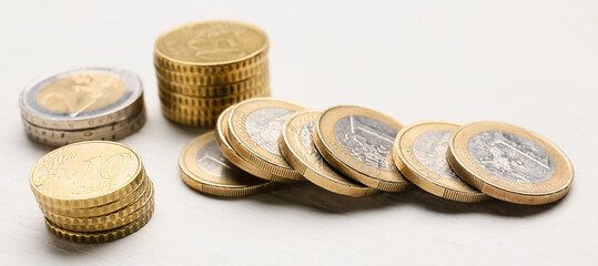 Many coins on light background