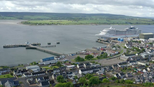 Drone increasing height and revealing city of Invergordon - Scotland.