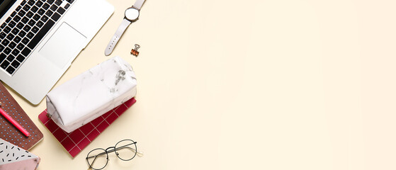 Pencil case, laptop and stationery on light background with space for text