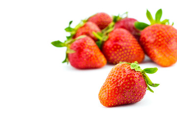 Fresh ripe strawberries on a white background.