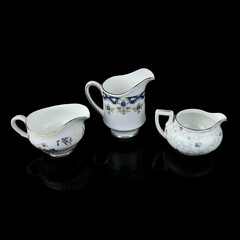 set of antique milk jars with golden pattern. retro vessel for milk. coffee service. vintage gravy boat