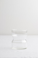 Empty glass on a white table