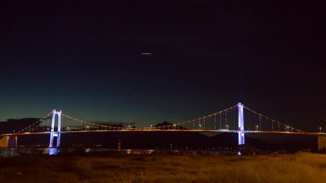 Beauty Thuan Phuoc Bridge architecture inside marina with glowing lights rays shining down river carried reliability in Da Nang, Vietnam.