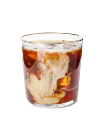 Delicious cold brew coffee with milk in glass on white background