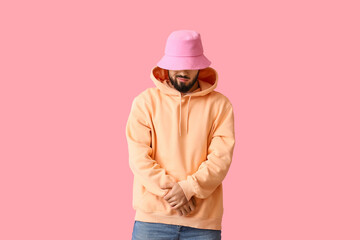 Fototapeta na wymiar Fashionable bearded man on pink background