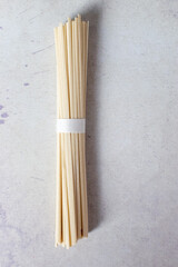 a bundle of uncooked udon noodles for Japanese cooking