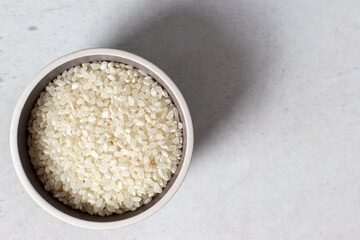 raw and uncooked pudding rice in a bowl