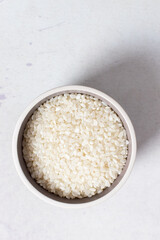 raw and uncooked pudding rice in a bowl