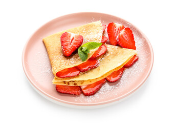 Plate of thin pancakes with strawberries and mint leaves on white background