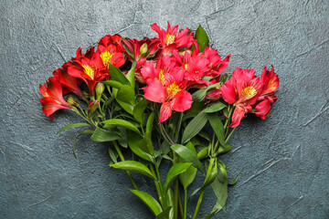 Bouquet of beautiful alstroemeria flowers on dark color background, closeup
