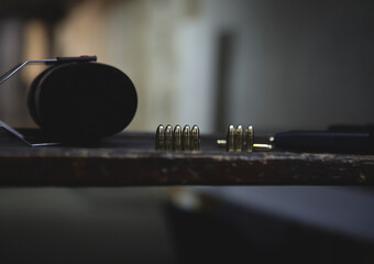Pistol bullets and weapon magazine in a shooting club