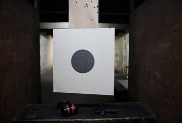 Pistol bullseye target training in a shooting club - obrazy, fototapety, plakaty