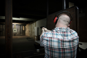 Pistol bullseye target training in a shooting room